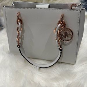 Michael Kors small purse. Brand new in original packaging.